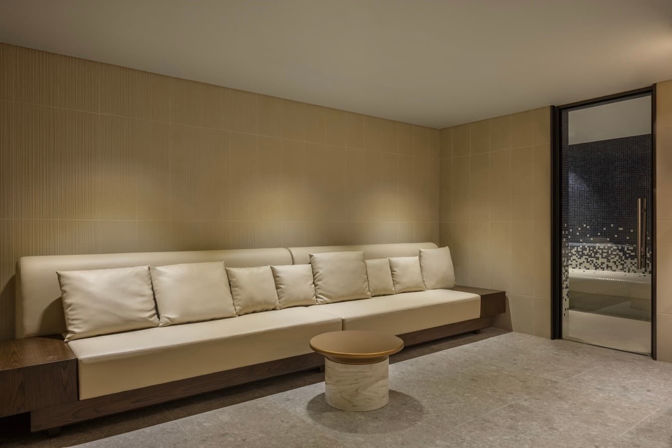 Cream leather lounge beside the steam room door