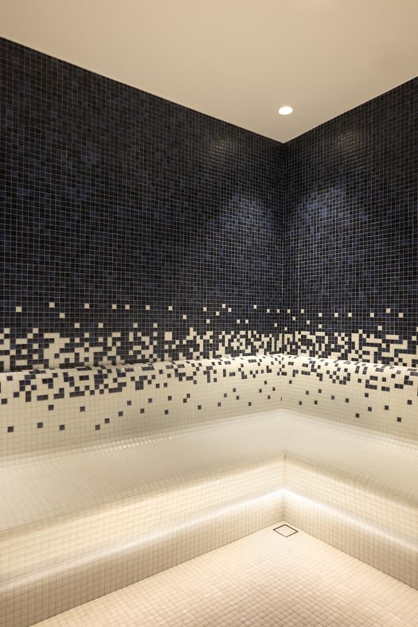 Corner of the mosaic steam room with backlit benches, Navitas Spa Hilton Istanbul Airport
